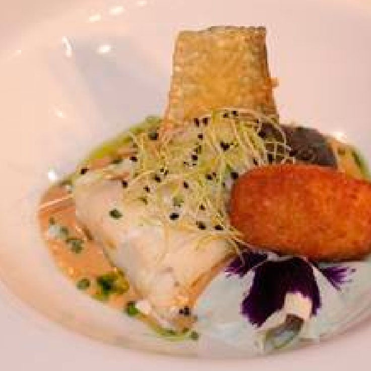 Bacalao confitado con azafrán sobre gachas manchegas